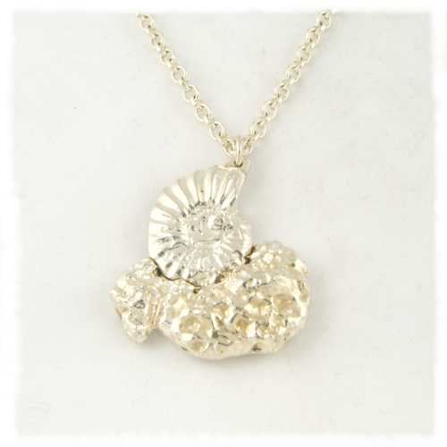 Silver ammonite on rock pendant